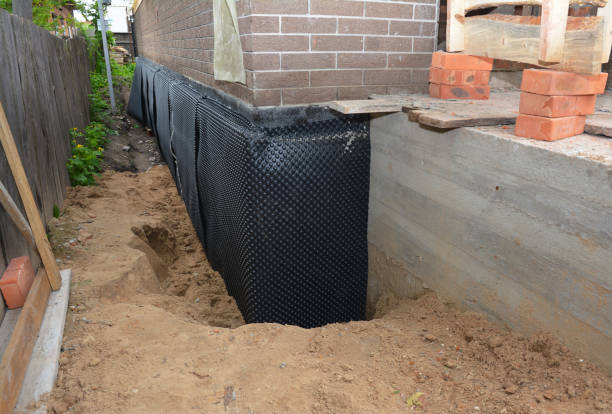 SJ Waterproofing Pros technician performing targeted Emergency Waterproofing assessment in Geneva, IL
